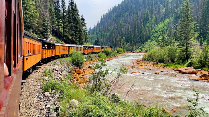 View of the Animas River and the Durango and Silverton Narrow Gauge Railroad train as seen from a passenger’s perspective.