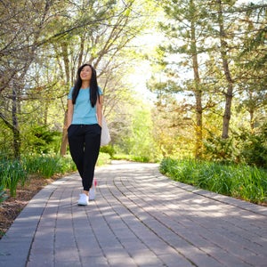 Woman Walking in a Park