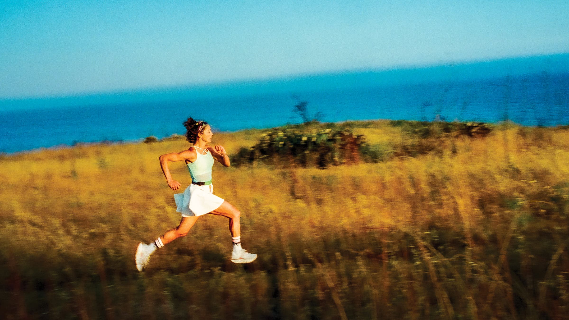 Alexi running on a trail