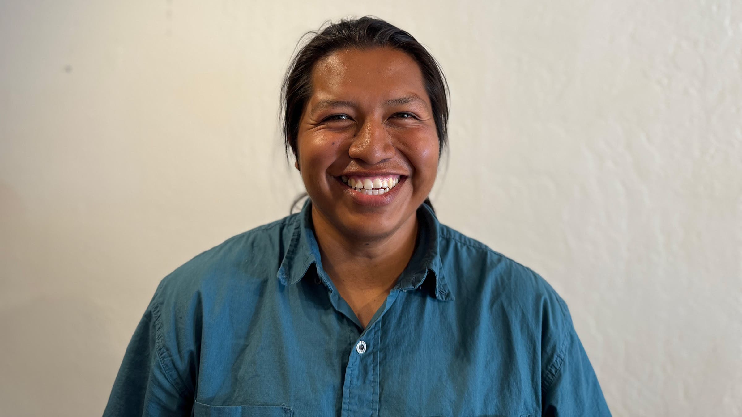 Headshot of male PCT hiker in front of white wall