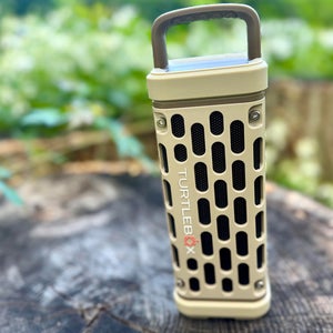 Turtlebox Ranger portable speaker set up on tree stump