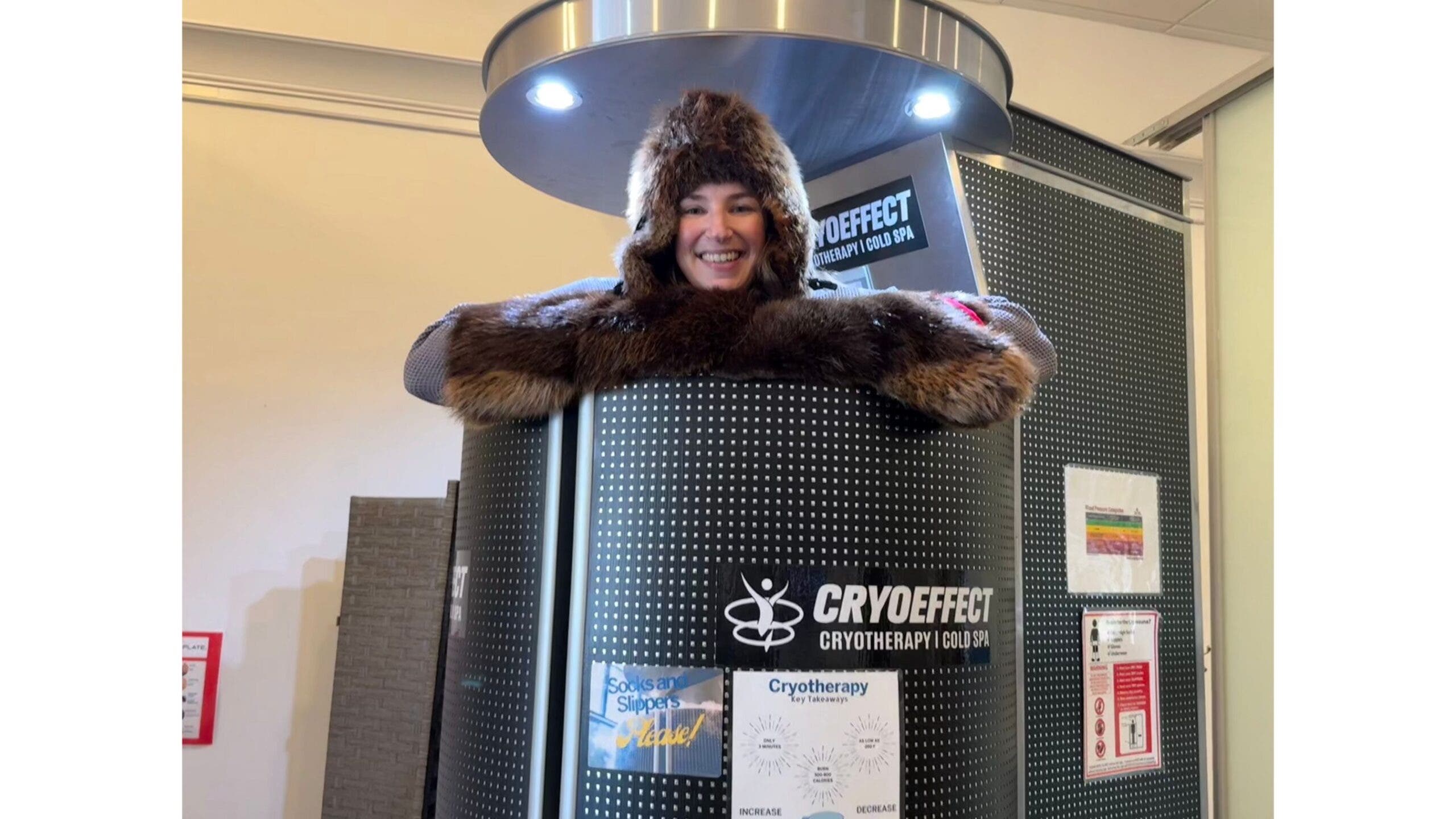 the author posing in the cryotherapy chamber