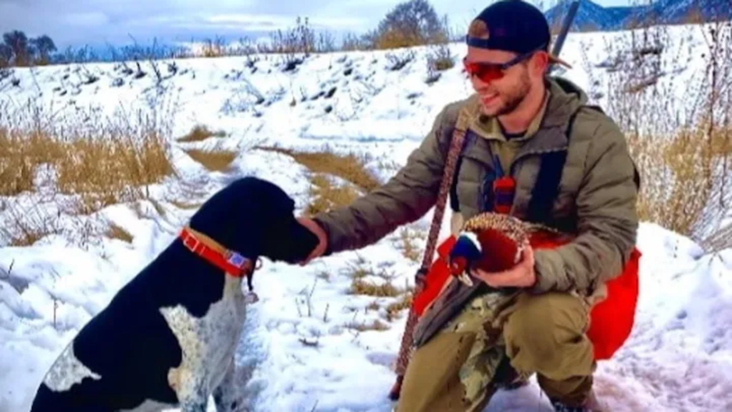 hunter petting his dog, buddy