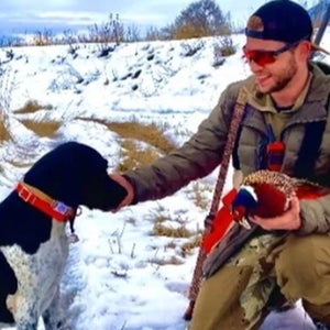 hunter petting his dog, buddy