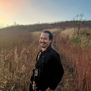 Kevin Sintumuang in a field