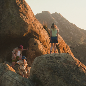 outdoorsy folks on a rock