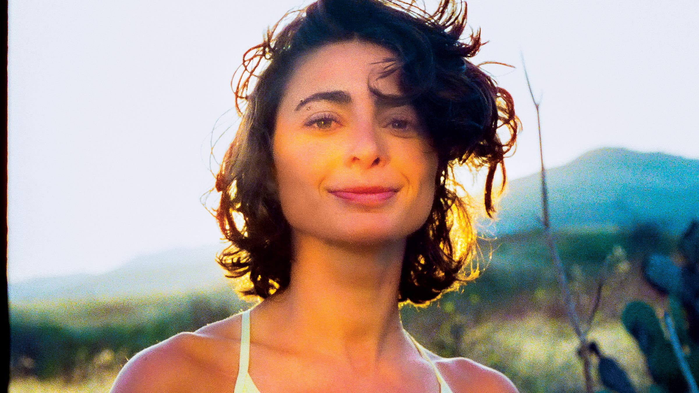 alexi pappas outside in a sports bra