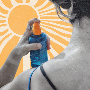 Close-up of young woman spraying sun cream on her neck on a sunny day on sun background