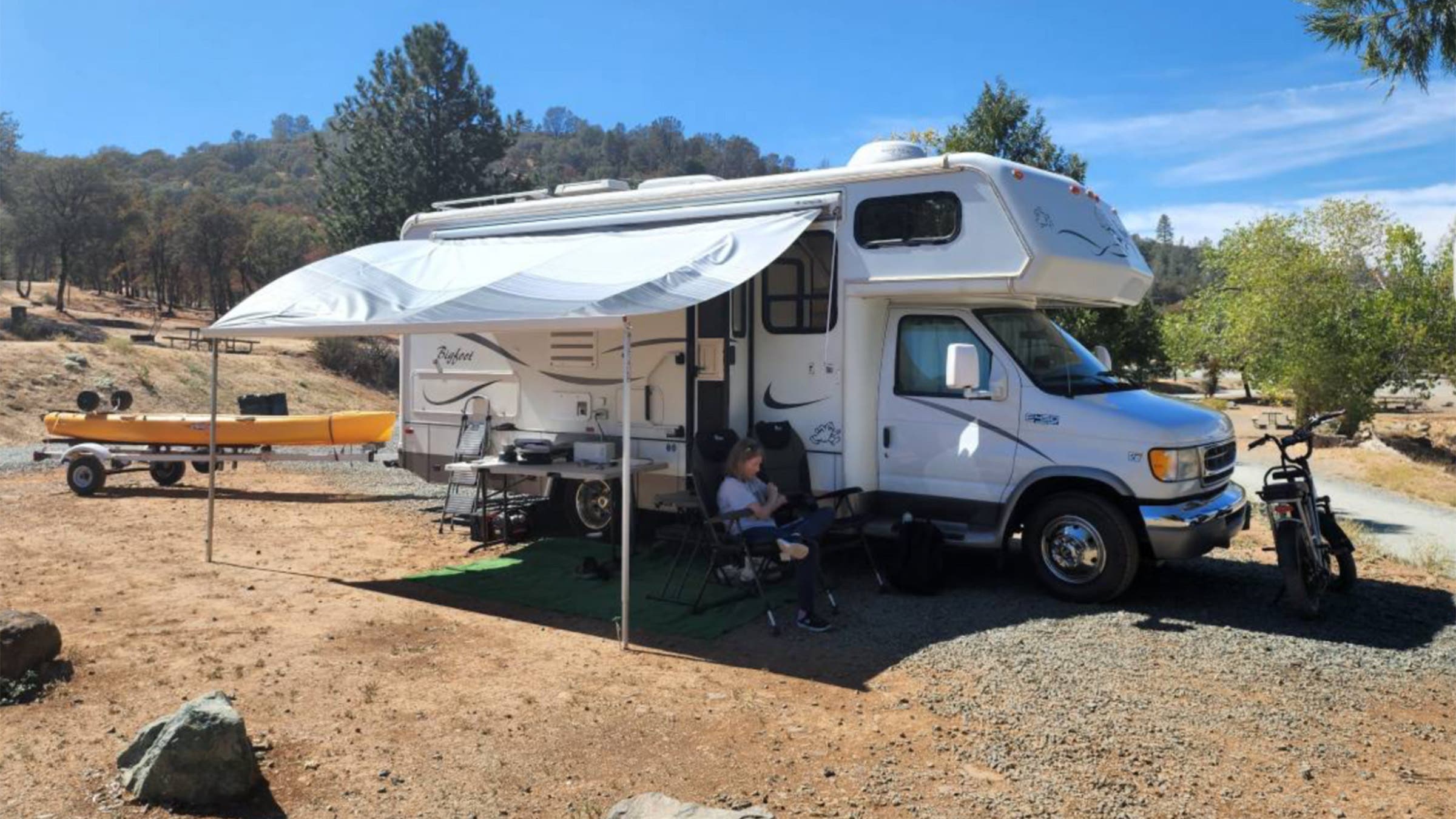 2002 Bigfoot 24’ Class C RV parked at camp spot