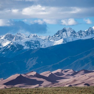 Telescopic view of the Sangre de Cristo mountain range over Great Sand Dunes National Park.