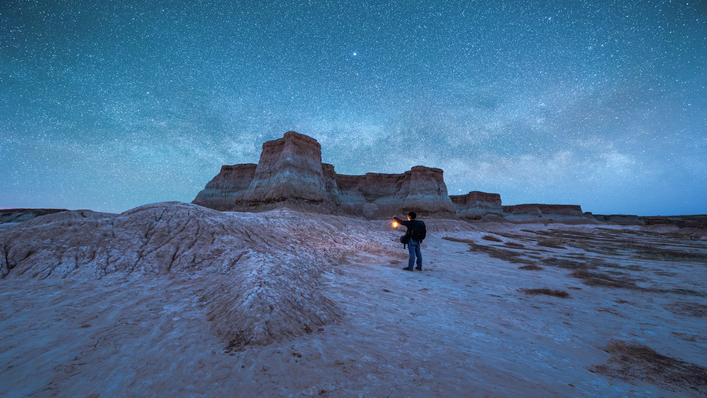 A traveler with a stirrup explores under the stars in Datong, Shanxi Province, China