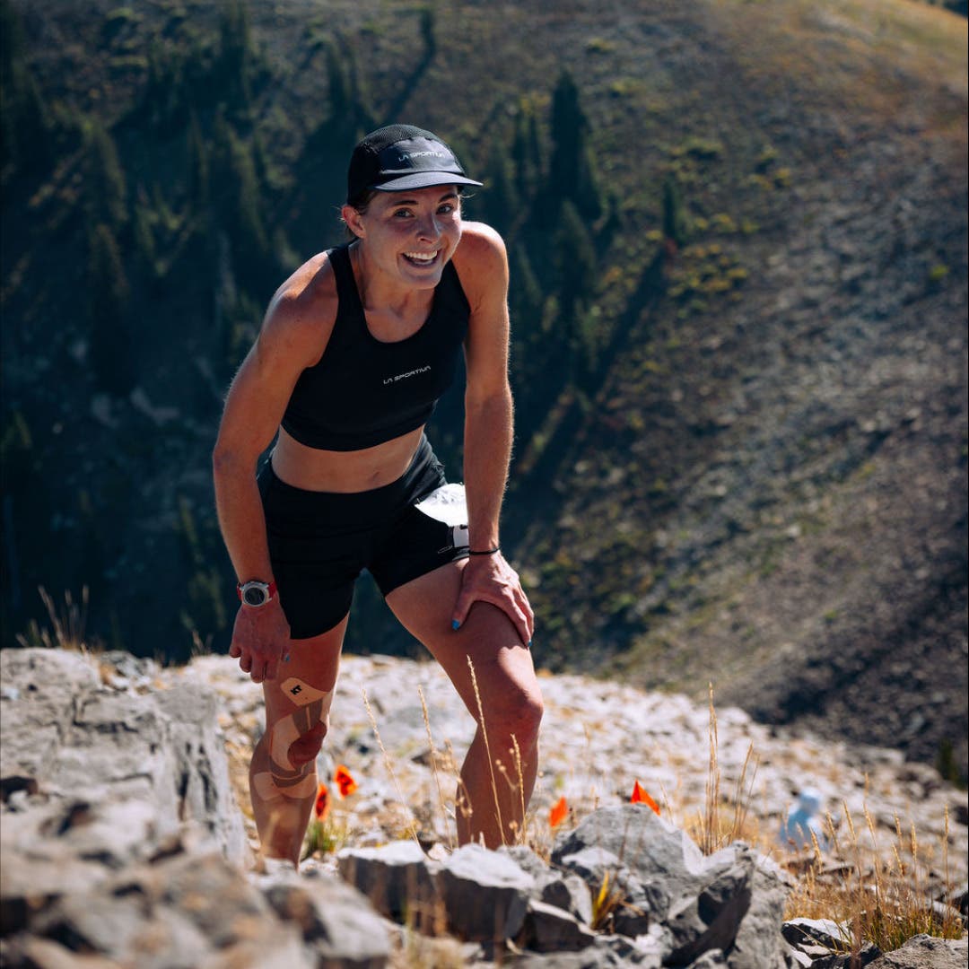 Jane Maus runs up a rocky slope