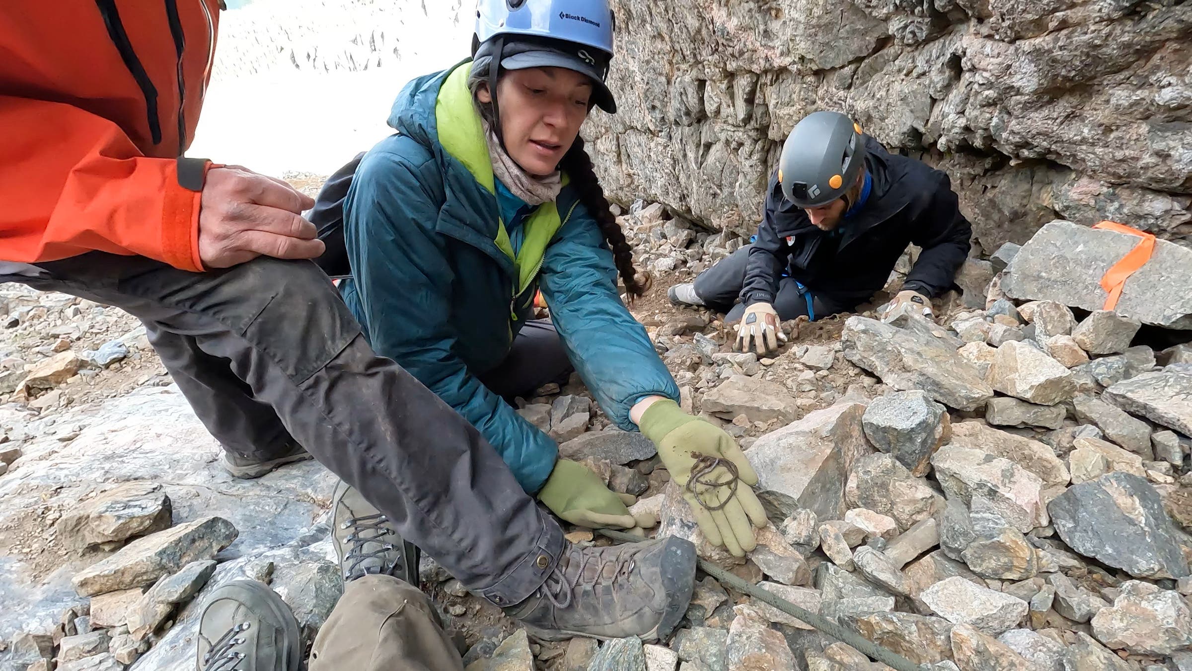 crew members holding necklace