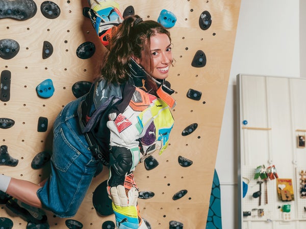 Nicole McLaughlin climbing in a wood board