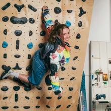 Nicole McLaughlin climbing in a wood board