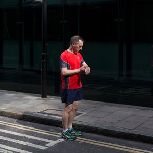 A man checks his fitness tracker