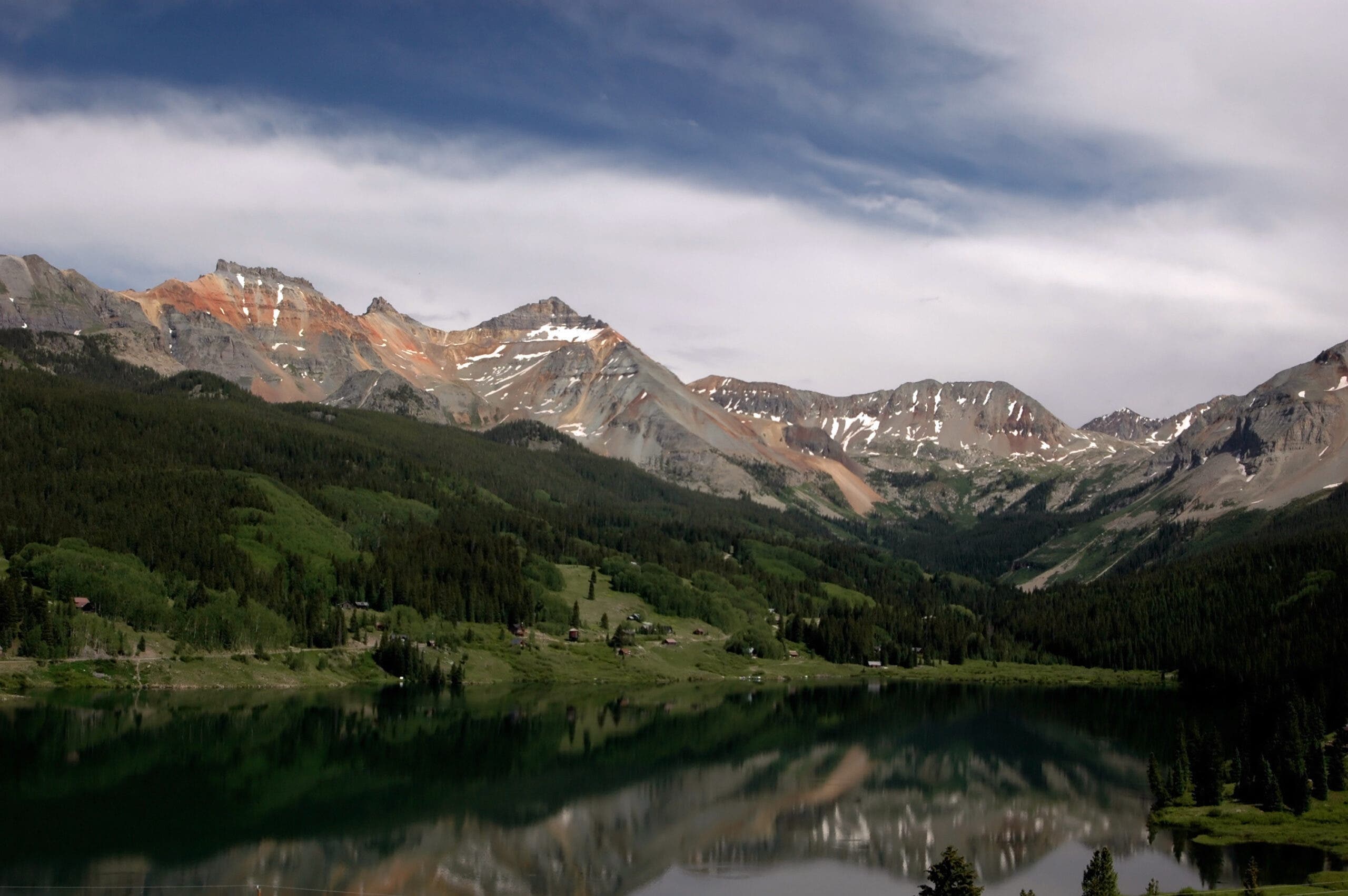 Vermillion Peak and Pilots Knob stand above Trout Lake in southwest Colorado.