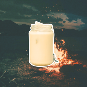 cold brew tea latte on a camping campfire background