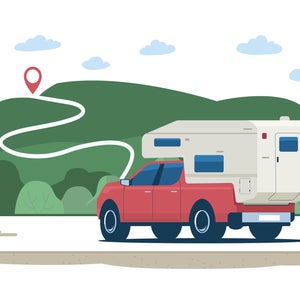truck with camper pointed to map pin