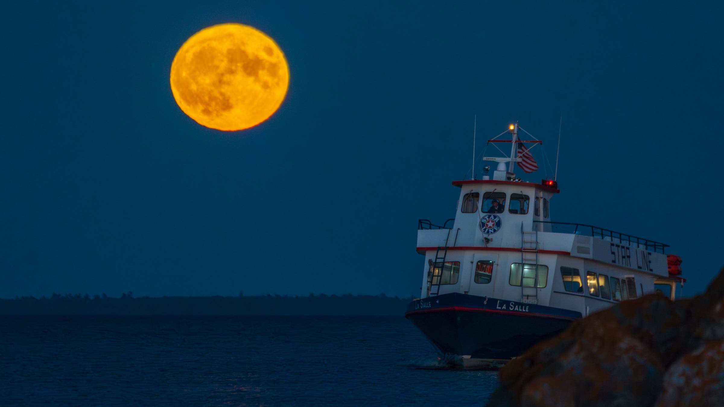 moon and boat on water