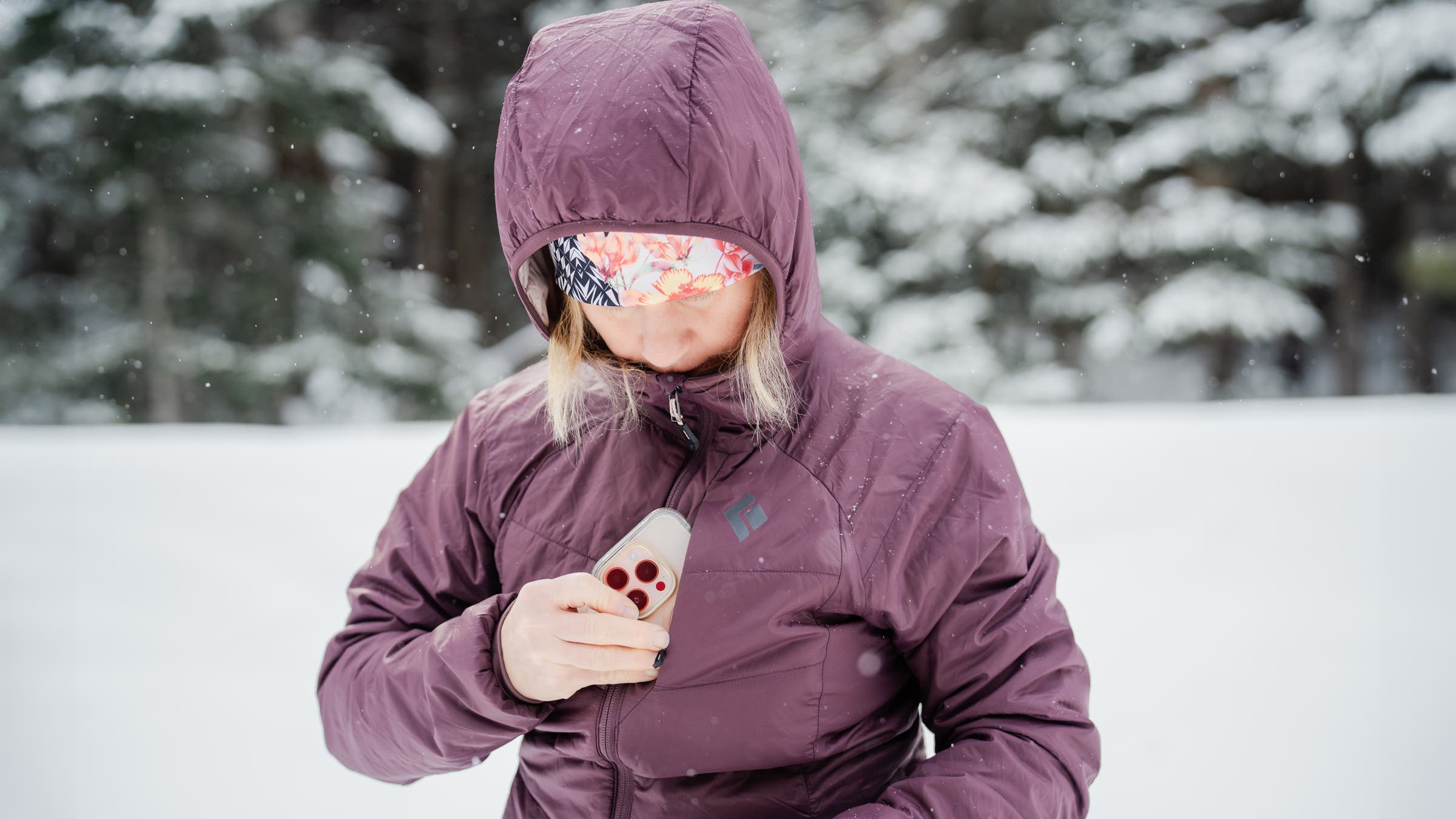 Black Diamond Solution 2.0 Hoodie midlayer testing phone in pocket