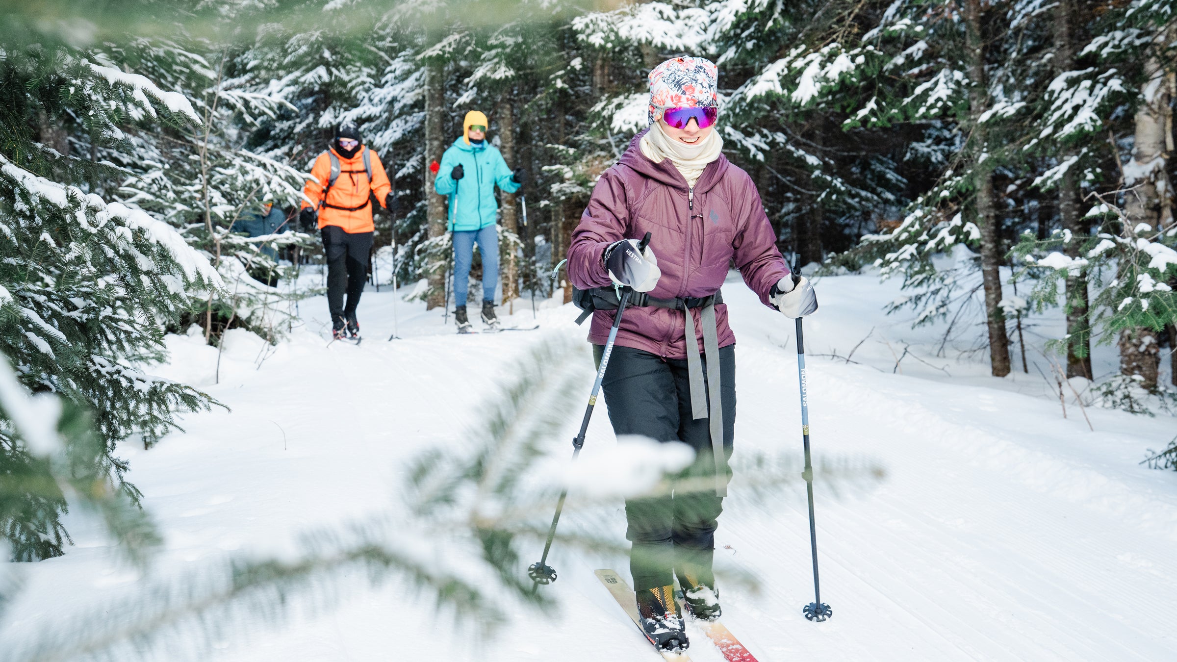 Snowy forest backcountry ski midlayer testing