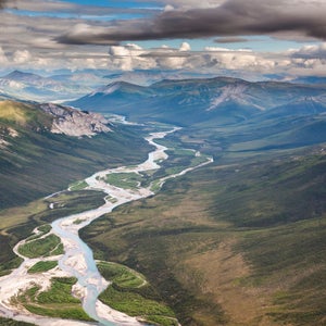 A river flows out of the Brooks Range mountains in Alaska’s Arctic