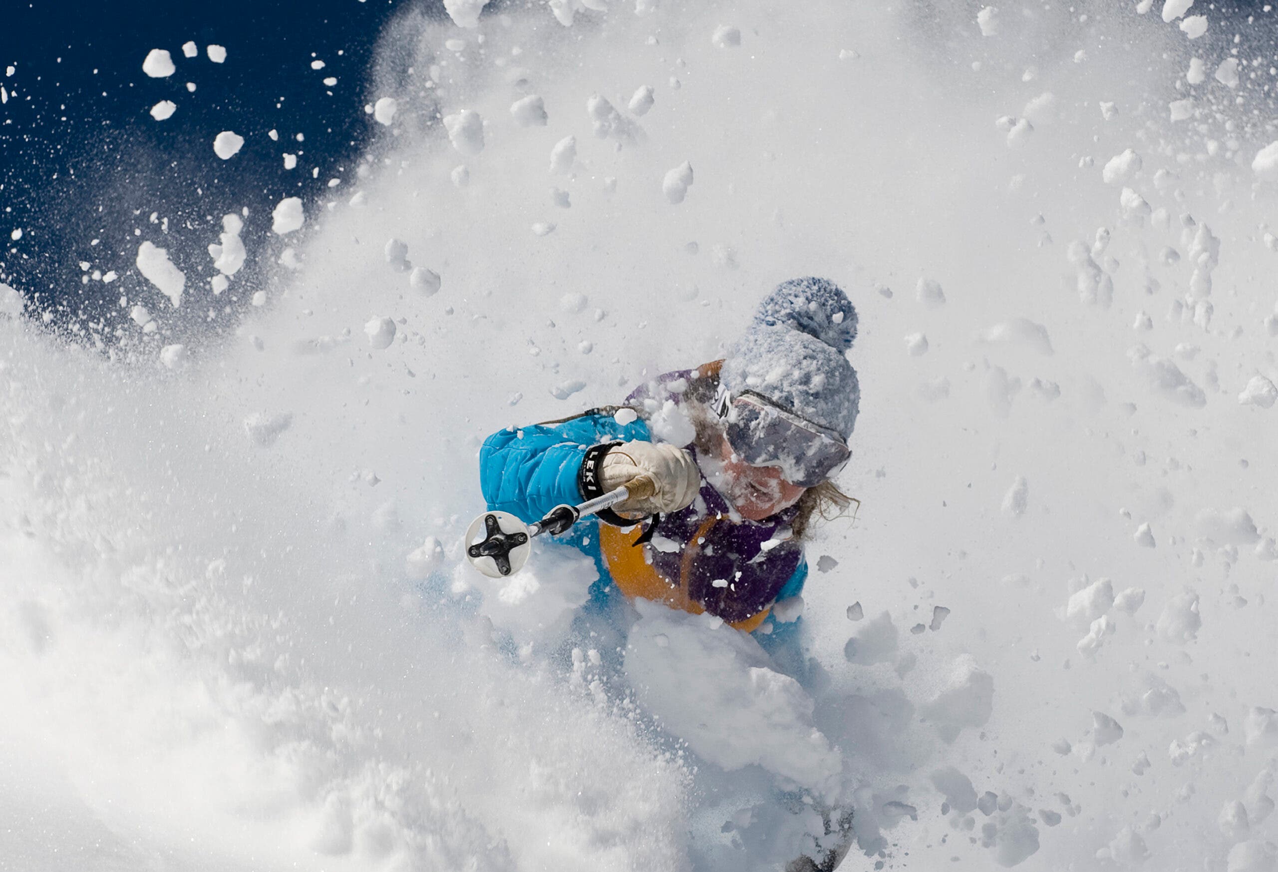 Woman skiing deep powder at Alta, Utah