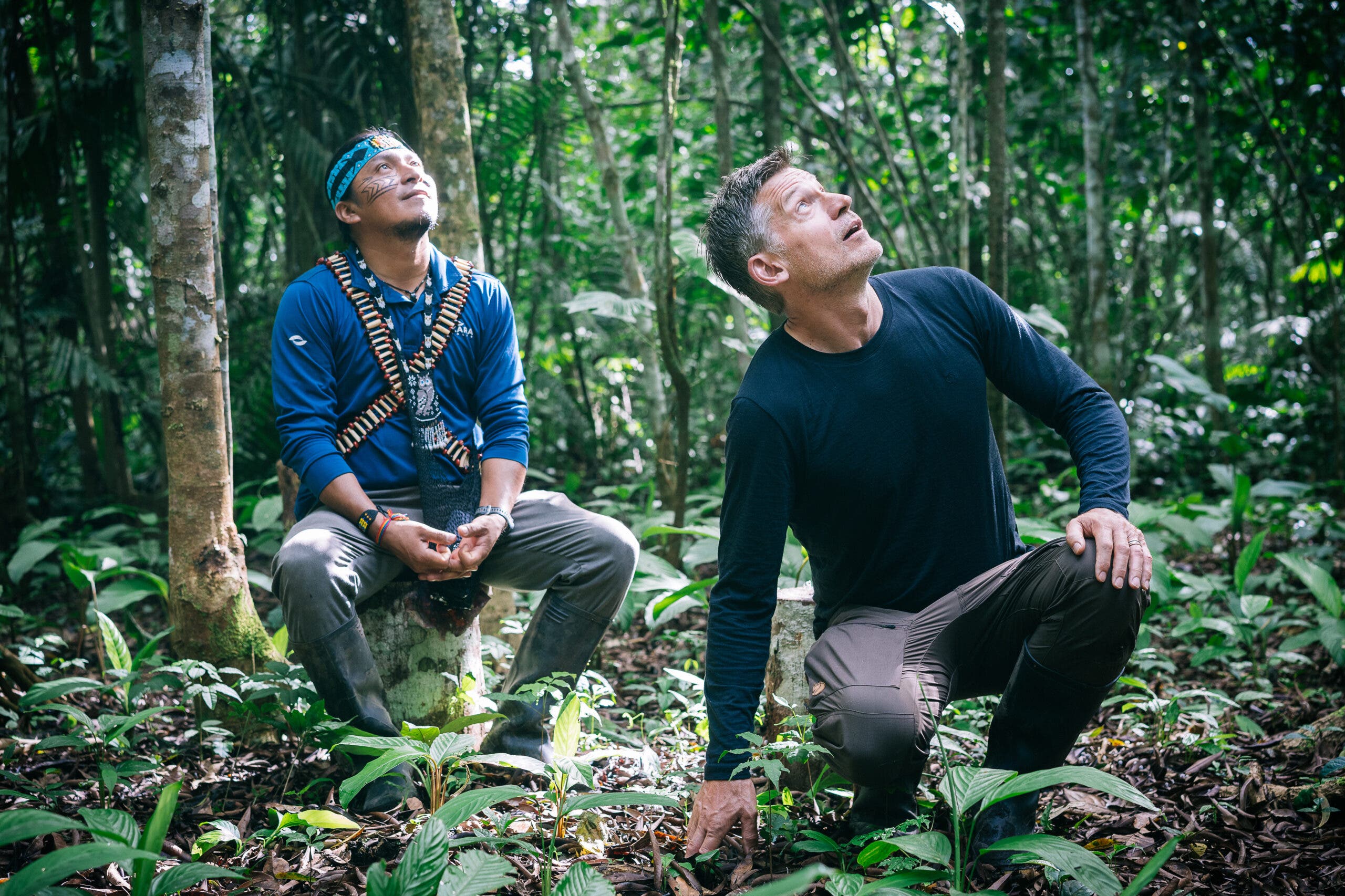Nikolaj and Nantu stare up at a massive Ceibo tree, thought to be to the tallest in the Ecuadorian Amazon.