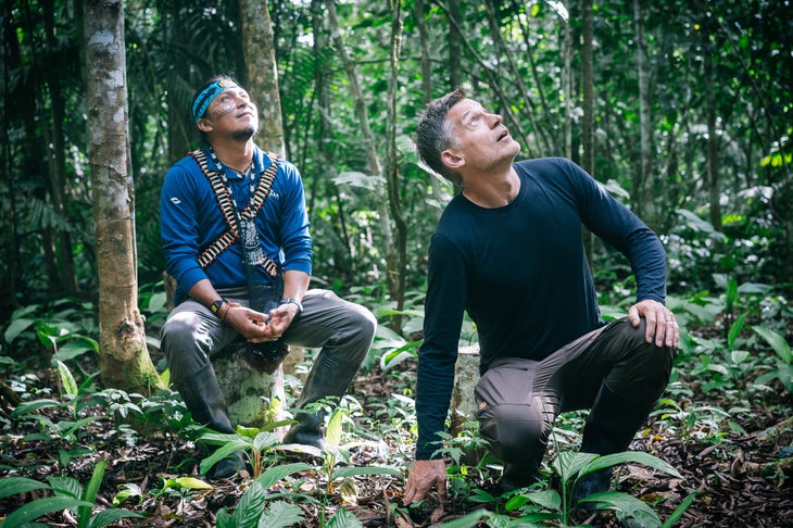 Nikolaj and Nantu stare up at a massive Ceibo tree, thought to be to the tallest in the Ecuadorian Amazon.