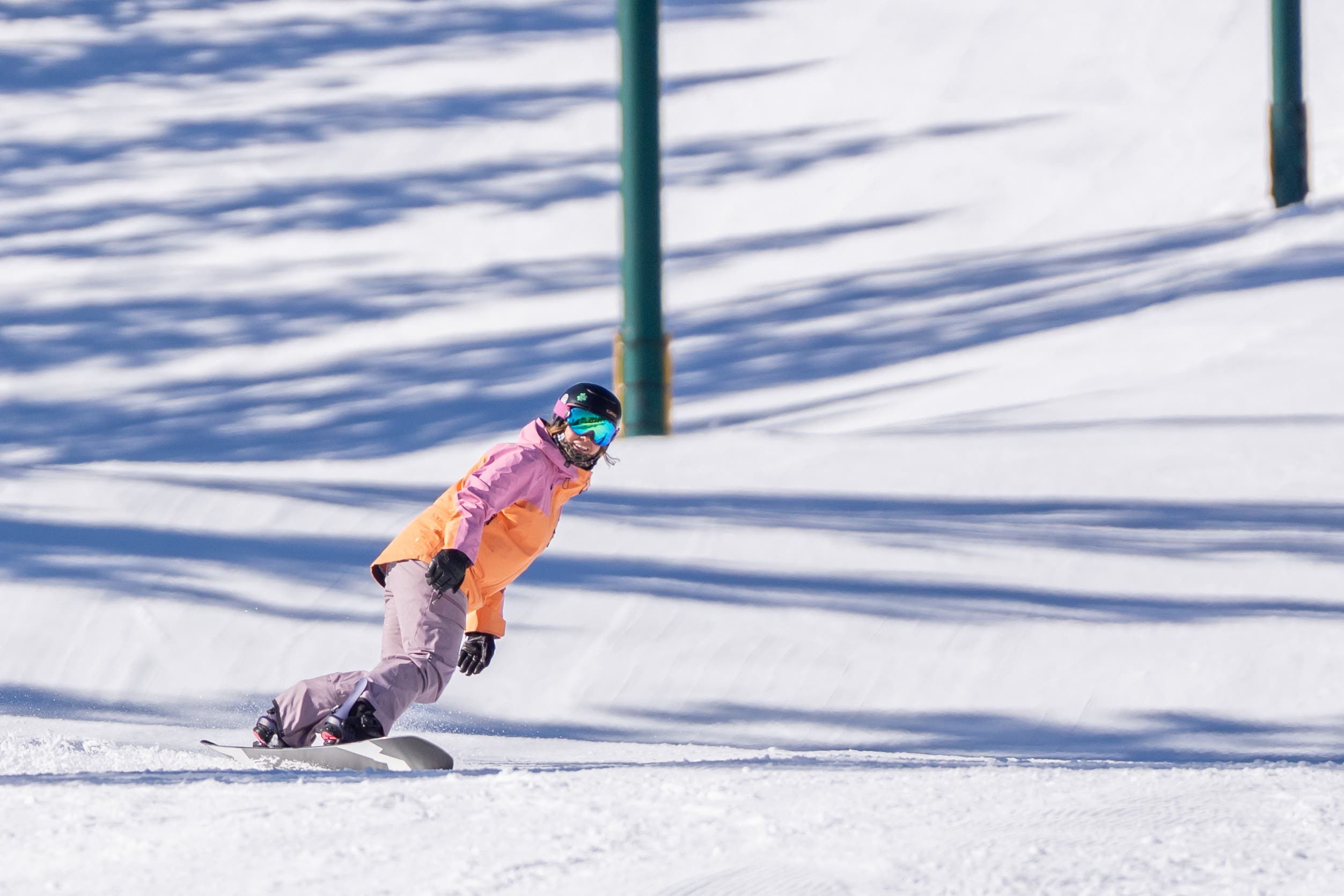 female snowboarding riding Weston Dream Machine
