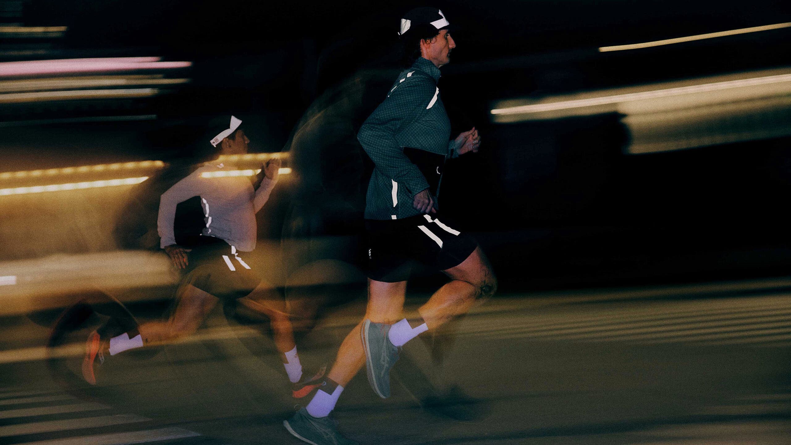 man and woman running in ciele niterite reflective running gear