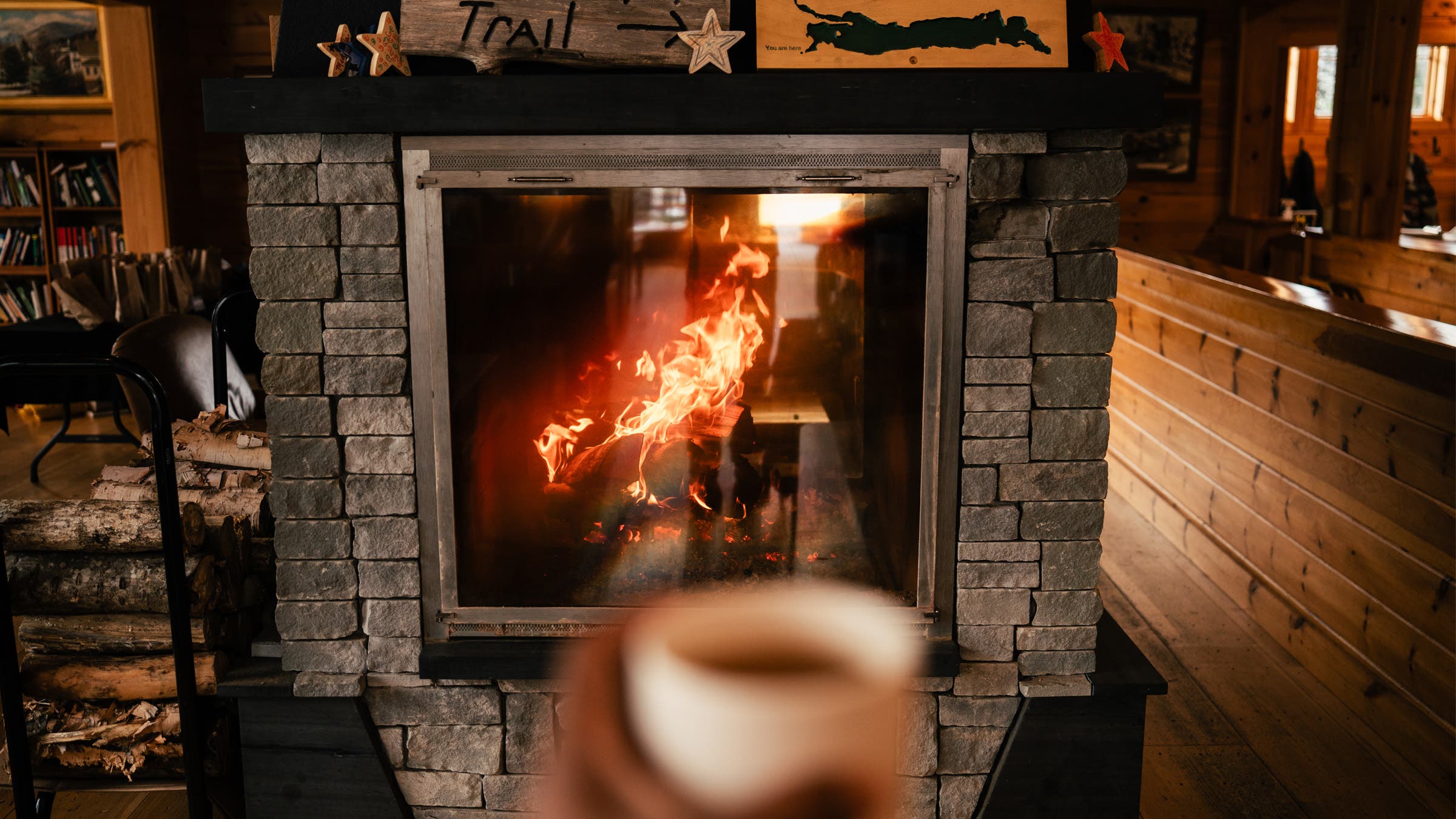 Warming by the fire at Medawisla Lodge in Maine