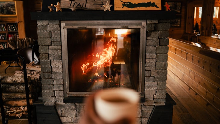 Warming by the fire at Medawisla Lodge in Maine