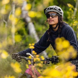 girl wearing smith sunglasses on a mountain bike