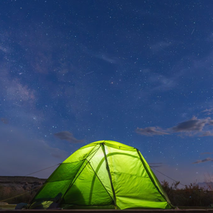 bright green stormbreak north face tent against a starry sky