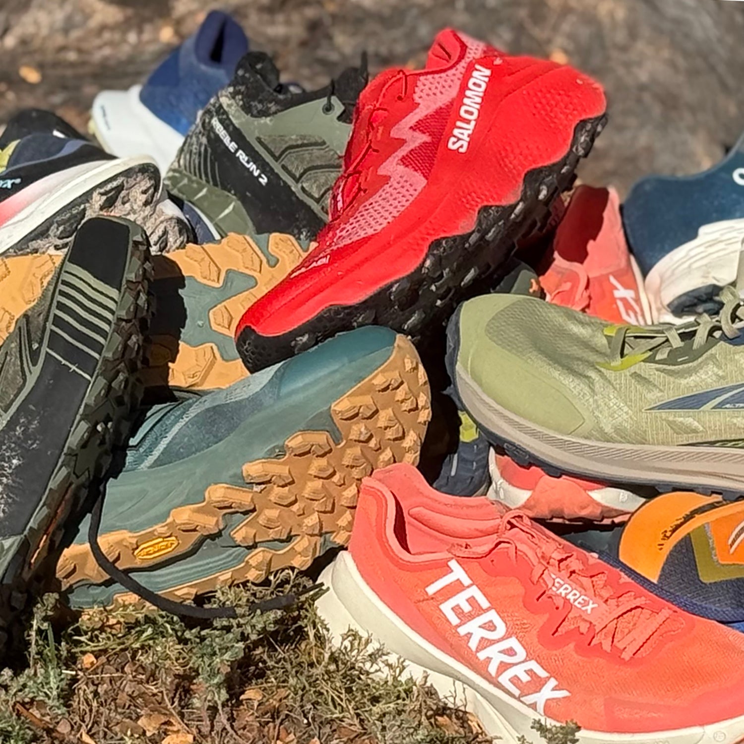 Trail running shoes in pile after testing