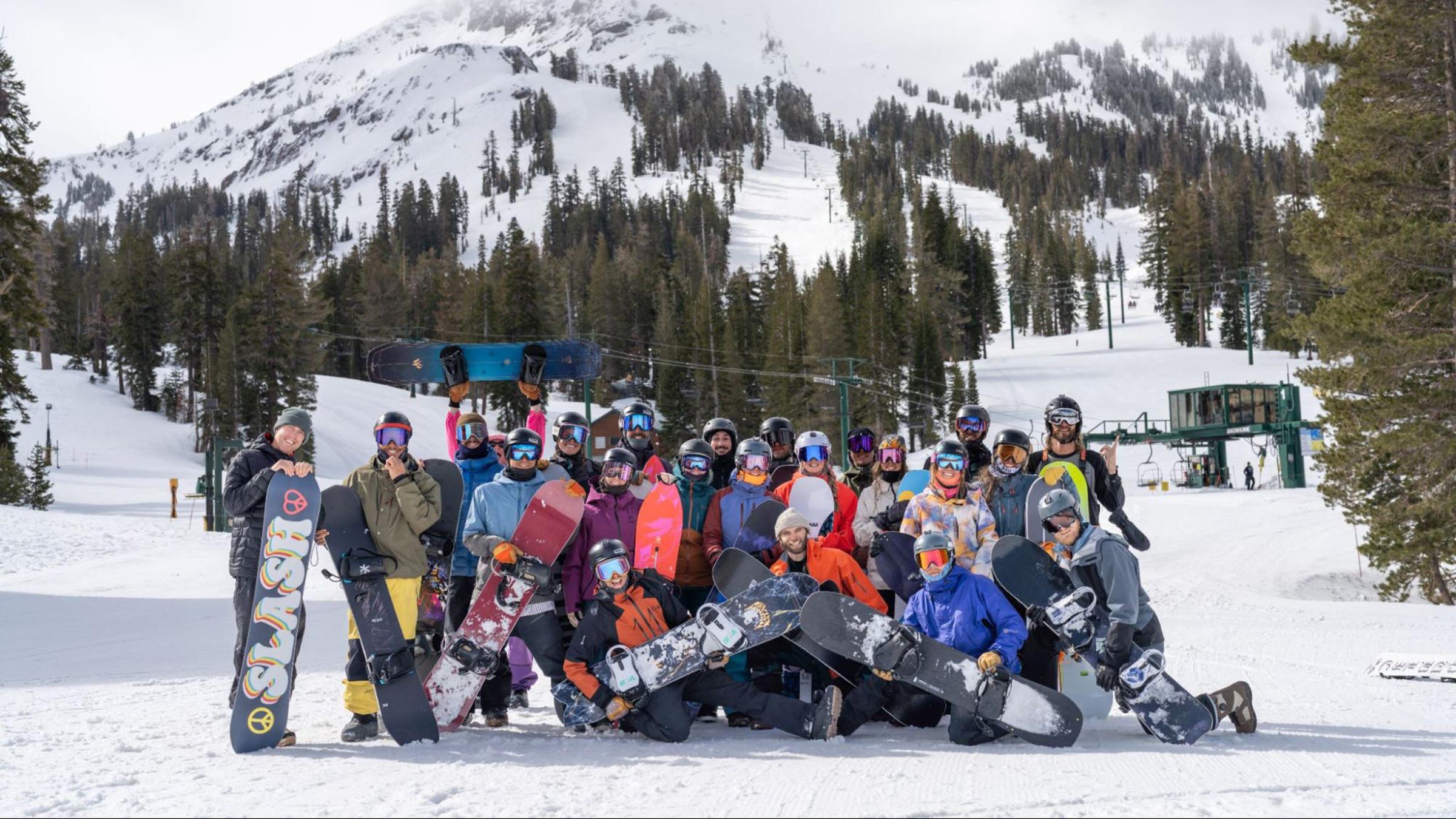 Snowboarders posing for group photo at Outside Snowboard Test at Kirkwood