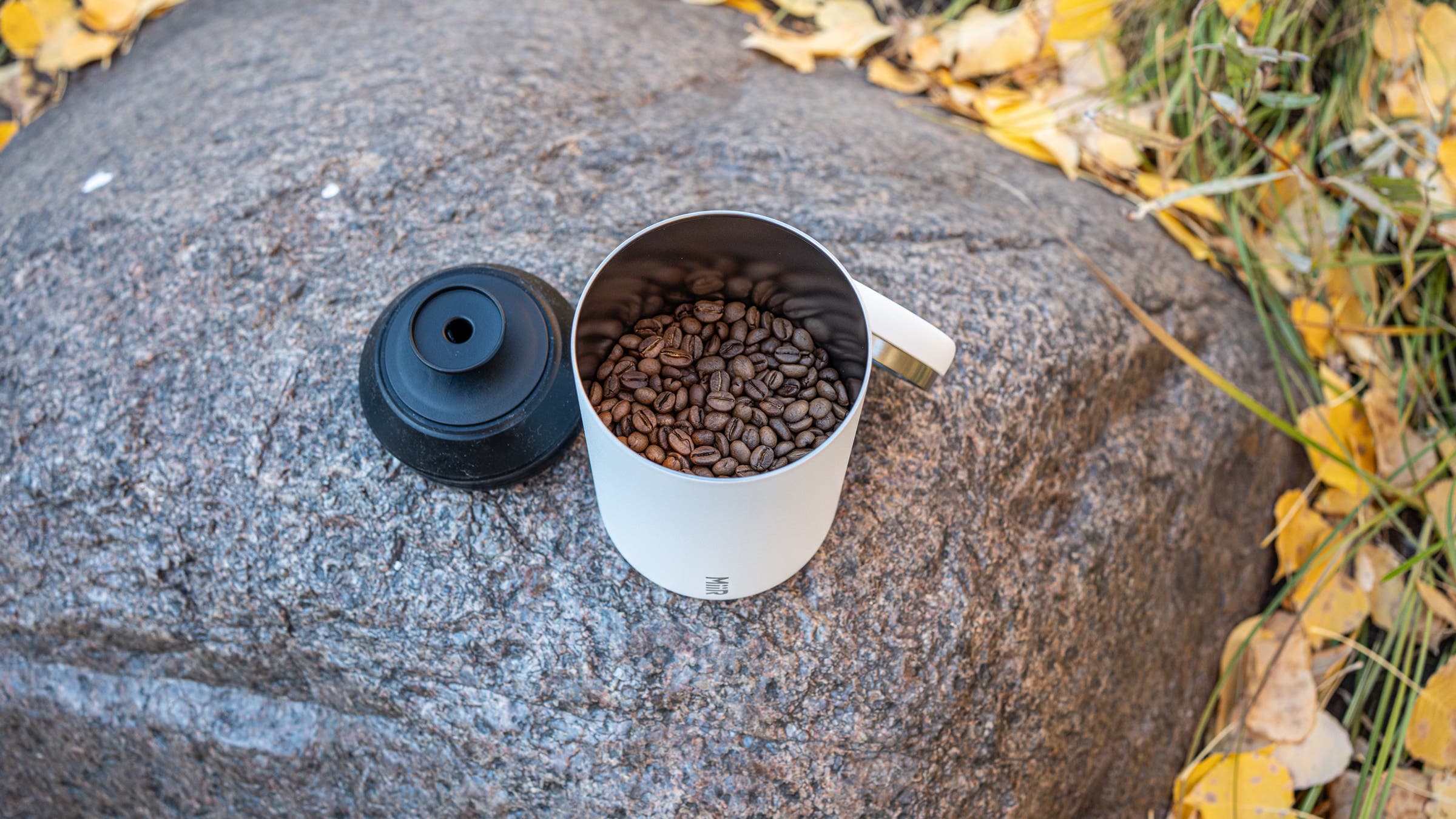 MiiR Airlock Coffee Canister on rock near river