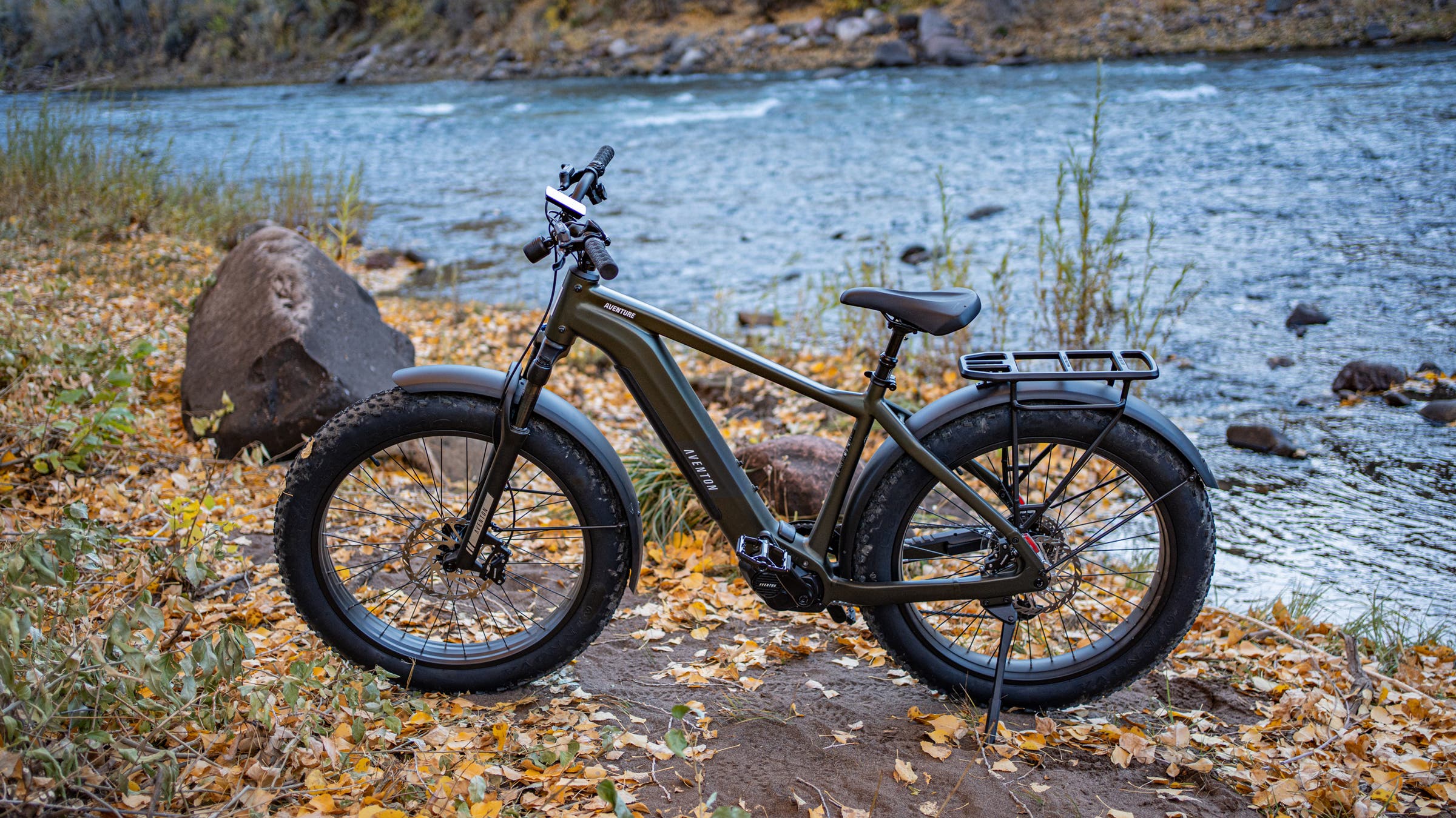 Aventon Aventure Mid Drive next to river