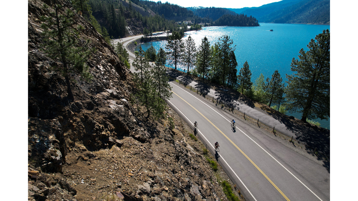 Athletes compete in the bike leg during IRONMAN on June 26, 2022 in Coeur d'Alene, Idaho