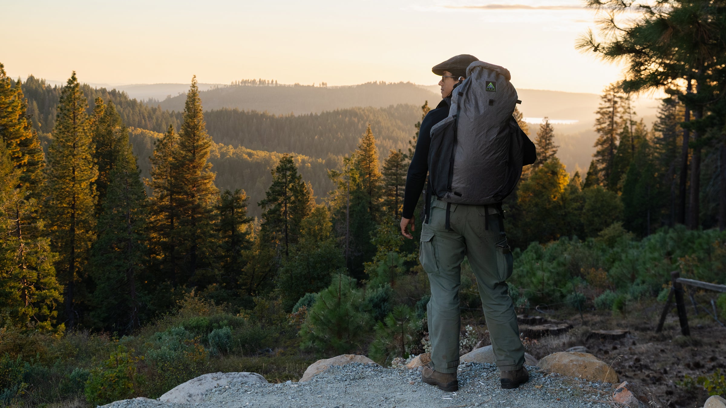 Everything you need to know about rucking feature person on mountain overlook with pack on