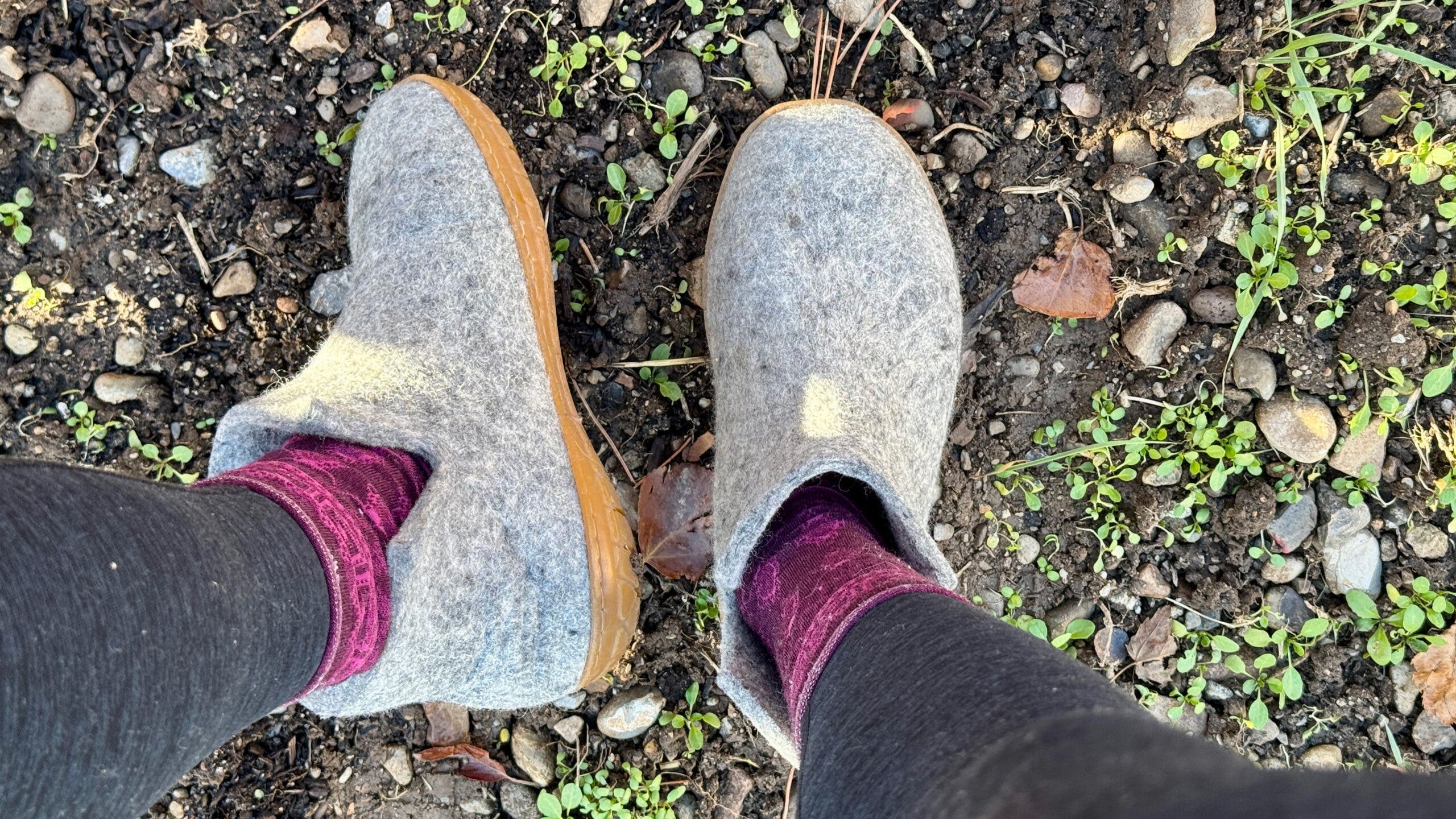 Aerial shot of grey Glerups wool slippers on feet