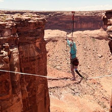 accessible adventure: a woman with a prosthetic leg walks a highline in the desert of moab