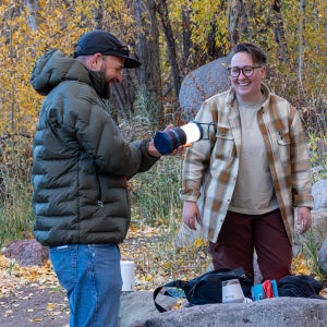Jakob and Erica reviewing gear at Outdoor Media Summit