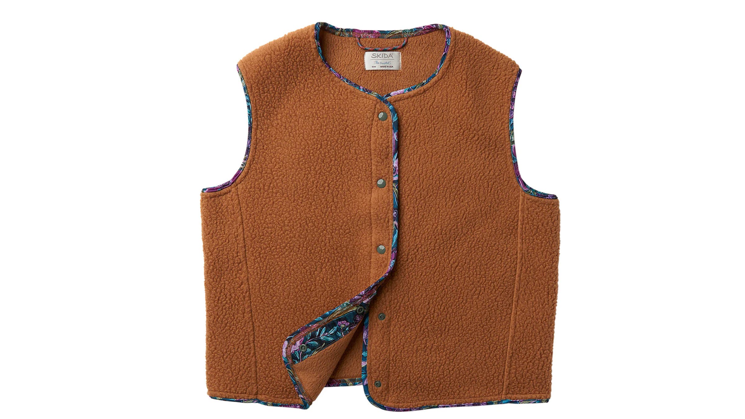 Brown fuzzy Skida women's vest with floral trim on white background