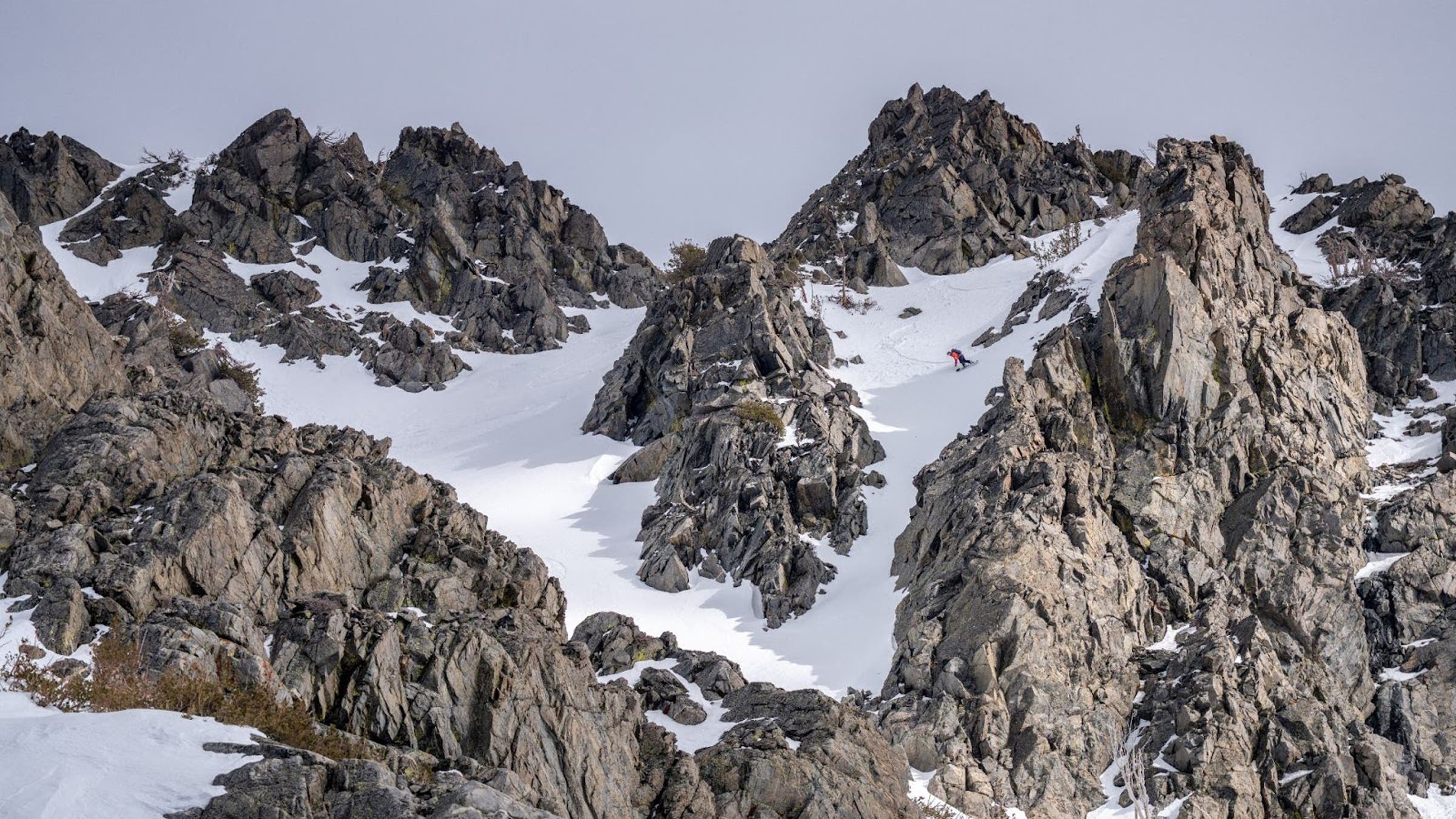 Chris Cloyd, a Blackbird Mountain Guide avalanche course instructor and one of our longtime splitboard testers, rips down an hourglass couloir in the Kirkwood sidecountry.