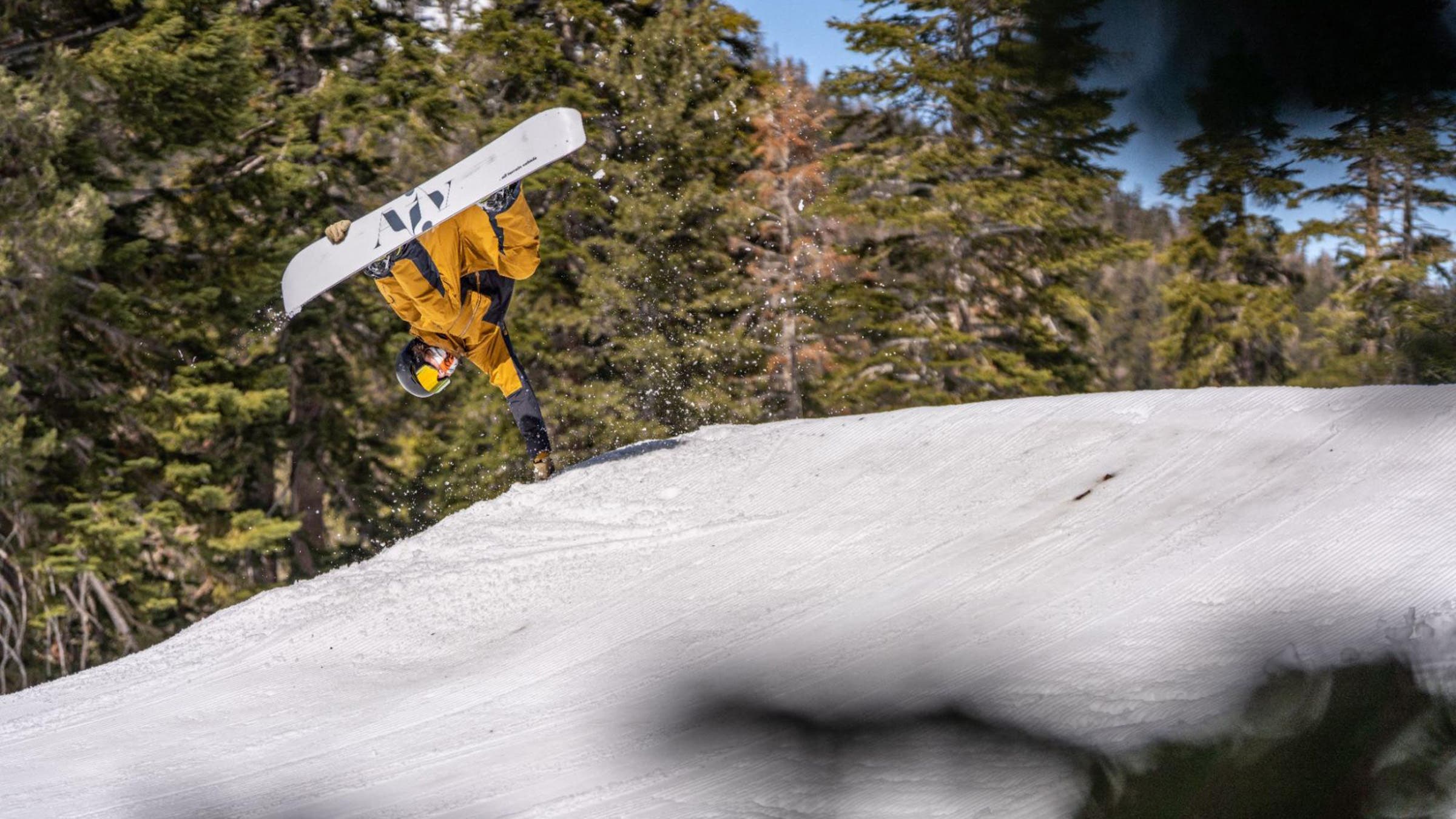 Snowboarder in mid air flip at Kirwood in 2025