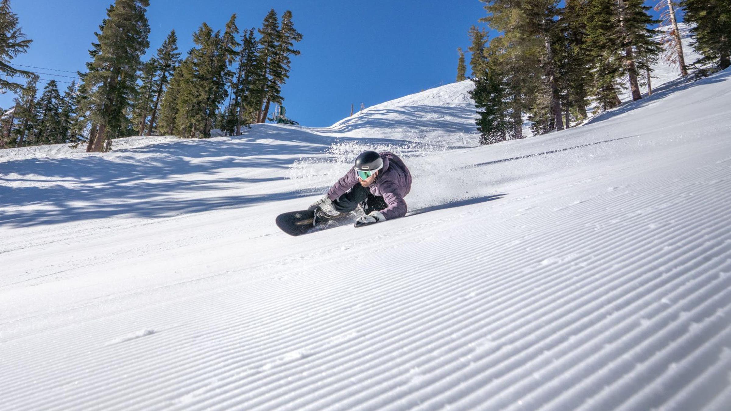 Snowboarder rides corduroy at Kirkwood in 2025