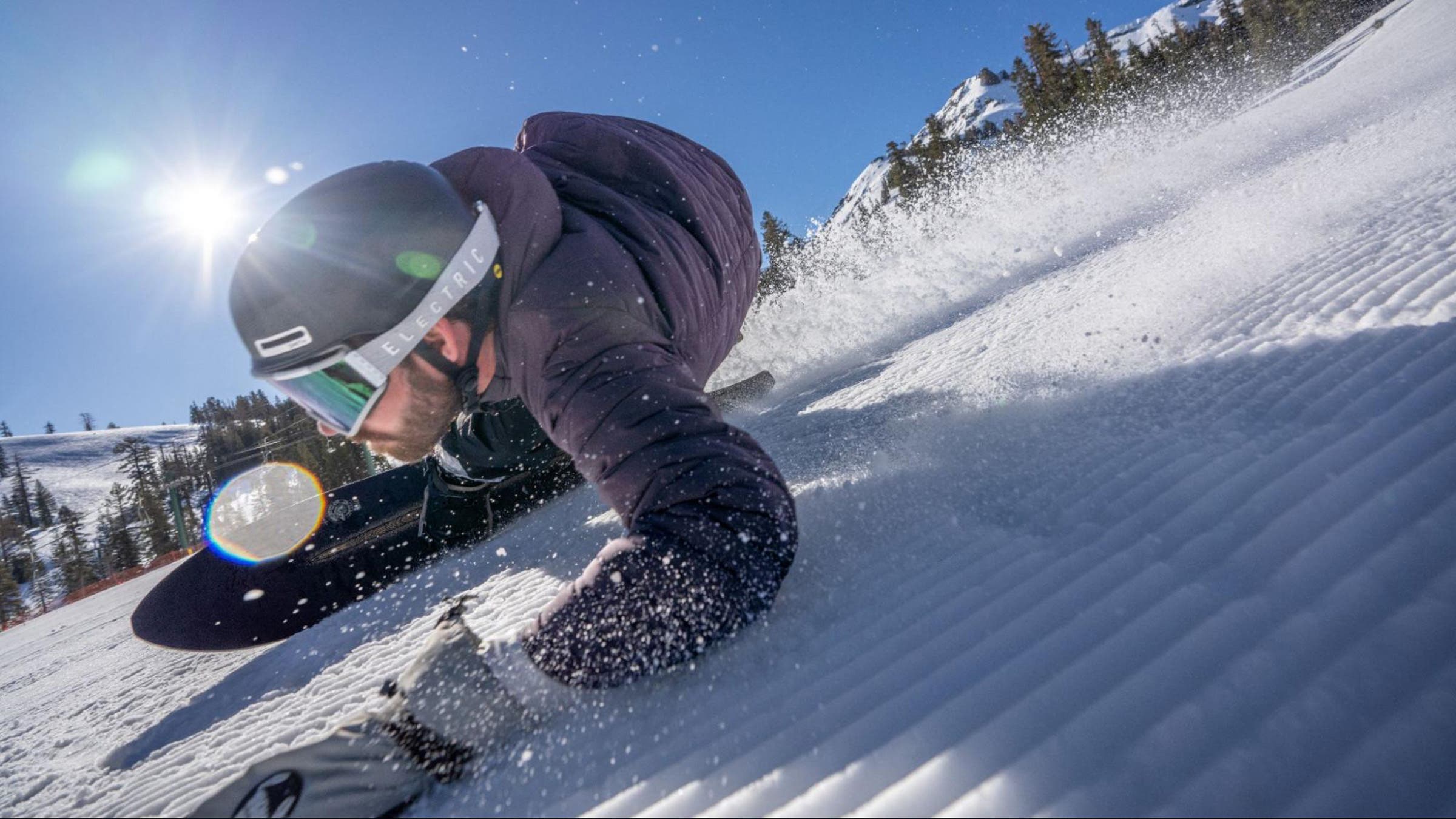 Snowboarder grazes corduroy at Kirwood in 2025